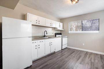 Lafayette apartment for rent - A kitchen with white appliances and cabinets.