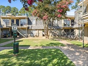 Lafayette apartment for rent - A sunny day at a residential complex with a green lawn and apartment buildings.