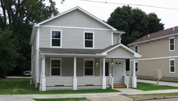 Erie apartment for rent - a white house with a white fence in front of it