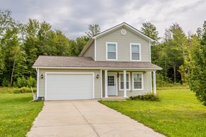 Fairview apartment for rent - a small gray house with a white garage door