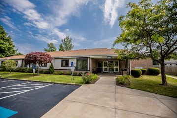 Erie apartment for rent - a bungalow with a driveway and trees in front of it