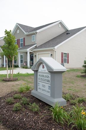 Erie townhouse for rent - a house with a sign in front of it