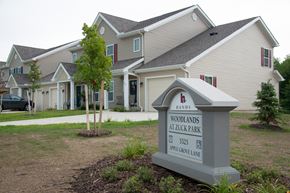 Erie townhouse for rent - a building with a sign in front of it