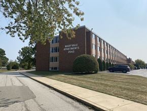Erie apartment for rent - an office building with a car parked in front of it