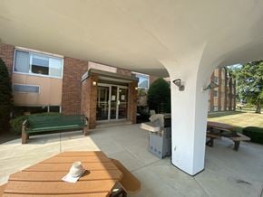 Erie apartment for rent - a view of a patio with a table and a grill