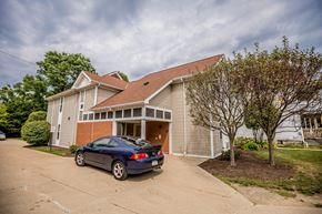 Erie apartment for rent - the front of a house with a car parked in the driveway