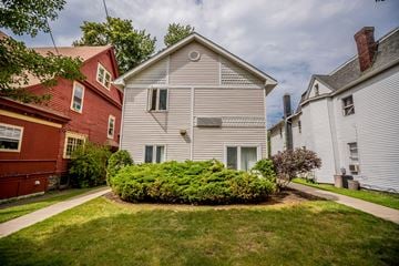 Erie apartment for rent - a white house with a yard in front of it