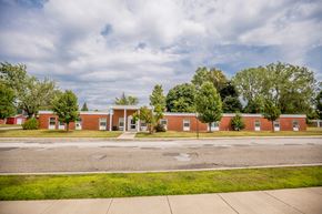 Erie apartment for rent - an empty street in front of a brick building