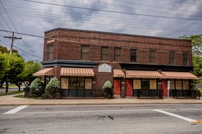 Erie apartment for rent - an old brick building on the corner of a street