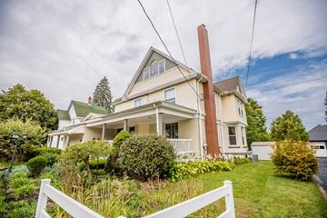 Corry apartment for rent - a white house with a lawn and a white fence