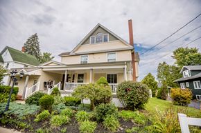 Corry apartment for rent - a white house with a garden in front of it