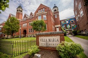 Erie apartment for rent - the facade of villa maria apartments on a sunny day