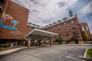 Erie apartment for rent - a large brick building with a mural on the side of it