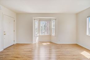 Los Angeles apartment for rent - A room with a white door and a window with a view of trees.