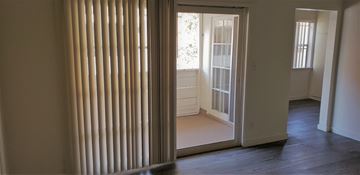North Hollywood apartment for rent - a living room with a window and a door to a room