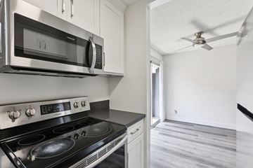 Los Angeles apartment for rent - A modern kitchen with a stainless steel stove and microwave.