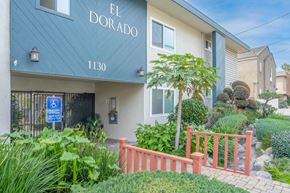 Gardena apartment for rent - The entrance to a building named El Dorado with a blue sign indicating it is handicap accessible.