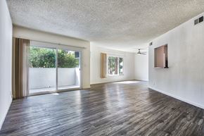 Los Angeles apartment for rent - an empty living room with wood flooring and a sliding glass door