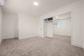 Covina apartment for rent - a white room with a white cabinet and a window