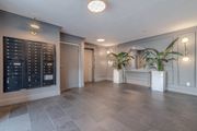 Los Angeles apartment for rent - A spacious room with a grey floor and a black cabinet on the wall.