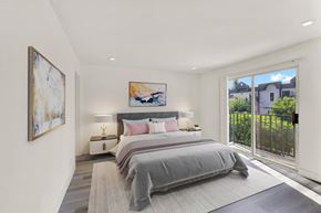 Los Angeles apartment for rent - A bedroom with a large bed and a painting on the wall.