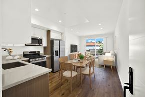Chatsworth apartment for rent - A modern kitchen with a dining table and chairs.