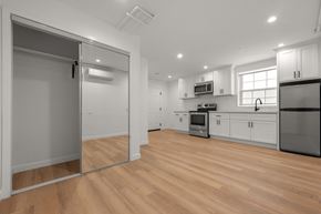 Los Angeles apartment for rent - A kitchen with wooden floors and white walls.