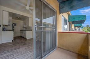 West Hollywood apartment for rent - a sliding glass door opens into the kitchen and living room