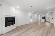 Los Angeles apartment for rent - A spacious living room with a fireplace and hardwood floors.