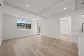 Los Angeles apartment for rent - A spacious room with wooden flooring and white walls.