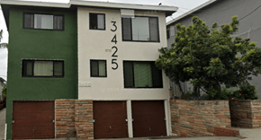 Los Angeles apartment for rent - A green and white house with the numbers 3425 on the side.