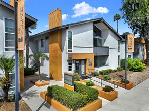 Downey apartment for rent - A building with a sign at The Square in Downey, CA, 90242