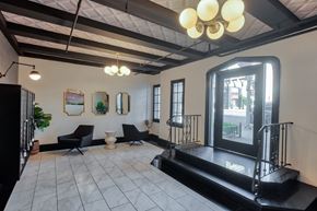 Los Angeles apartment for rent - A black and white living room with a large television.