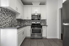 Los Angeles apartment for rent - A kitchen with a stove, oven, and microwave.