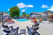Canyon Country apartment for rent - our apartments have a large pool with chairs and tables at Monterra Ridge Apartments,California