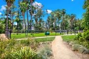 Canyon Country apartment for rent - a path leading to a park with a playground and trees at Monterra Ridge Apartments,California