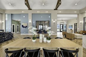 Greensboro apartment for rent - A dining room with a wooden table and chairs.
