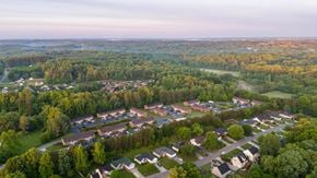 Winston Salem apartment for rent - A bird's eye view of a residential area surrounded by trees.