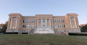 Lynchburg apartment for rent - a large brick building with a sign in front of it