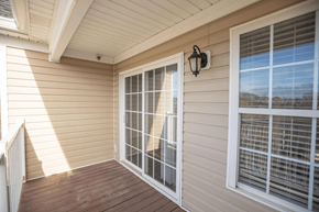 Lynchburg apartment for rent - a porch of a home with large windows and a wooden deck