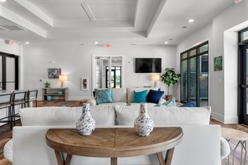 Myrtle Beach apartment for rent - A living room with a white couch and a wooden table.
