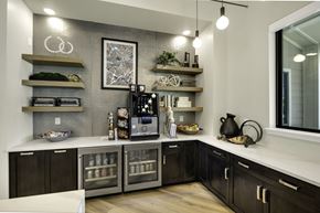 Greensboro apartment for rent - A modern kitchen with dark wood cabinets and stainless steel appliances.