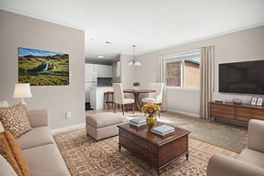Fayetteville apartment for rent - A living room with a couch, chair, and coffee table.