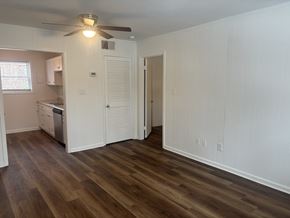 Winston Salem apartment for rent - A room with wooden floors and white walls.