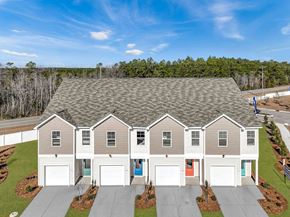Longs apartment for rent - A large house with a grey roof and four garages.