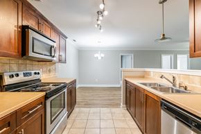 Parkton apartment for rent - A kitchen with wooden cabinets and stainless steel appliances.