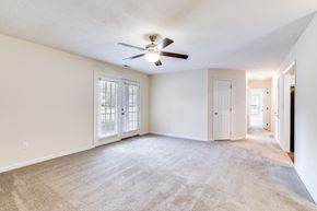 Hope Mills apartment for rent - A room with a ceiling fan and carpeted floor.
