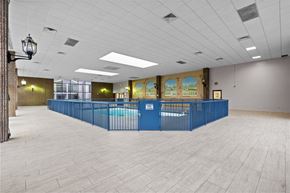 Fayetteville apartment for rent - A large room with a long blue table and a pool table.