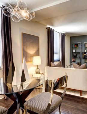 Norfolk apartment for rent - A modern dining room with a glass table and chairs.