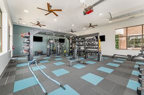 Winston Salem apartment for rent - a spacious fitness room with weights and cardio equipment